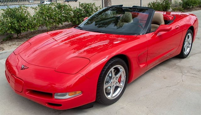 2002 red corvette convertible coming